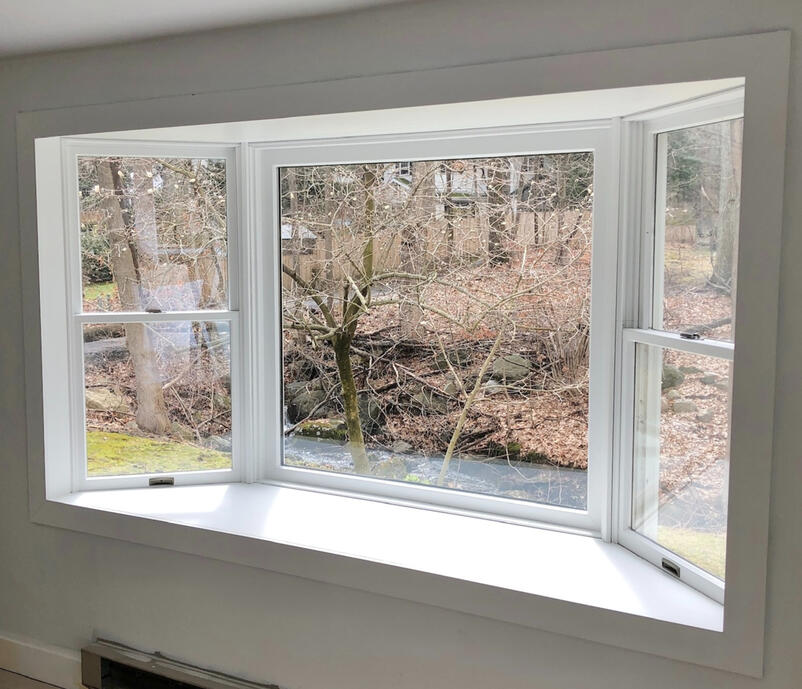 Refinished and painted bay window trimming
