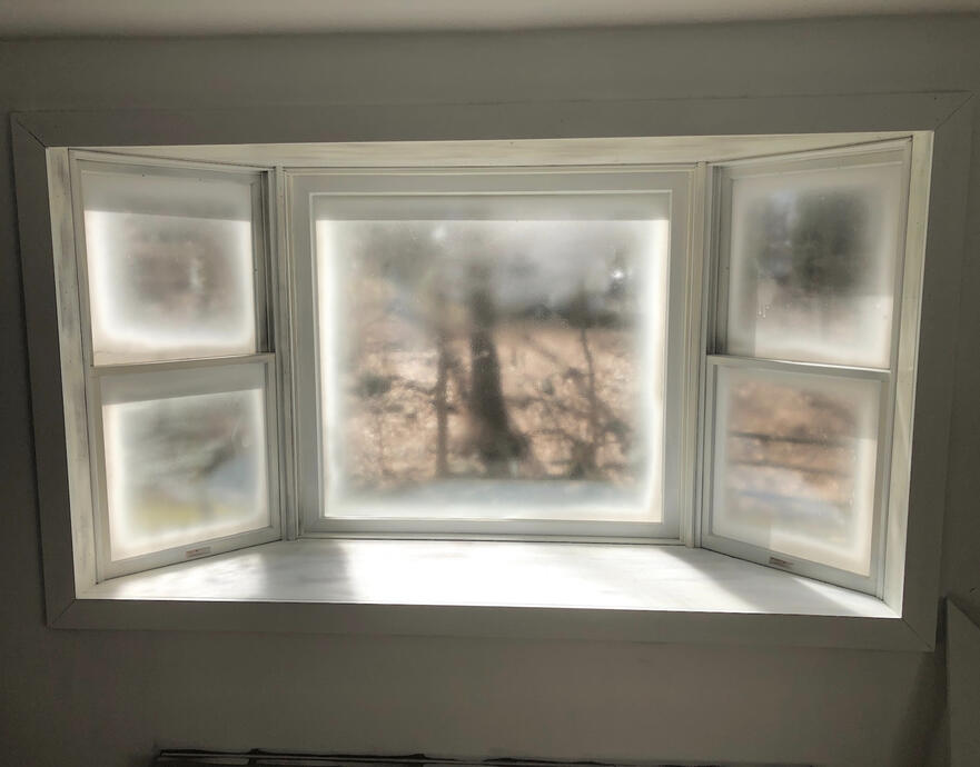 Progress image of window trim painting