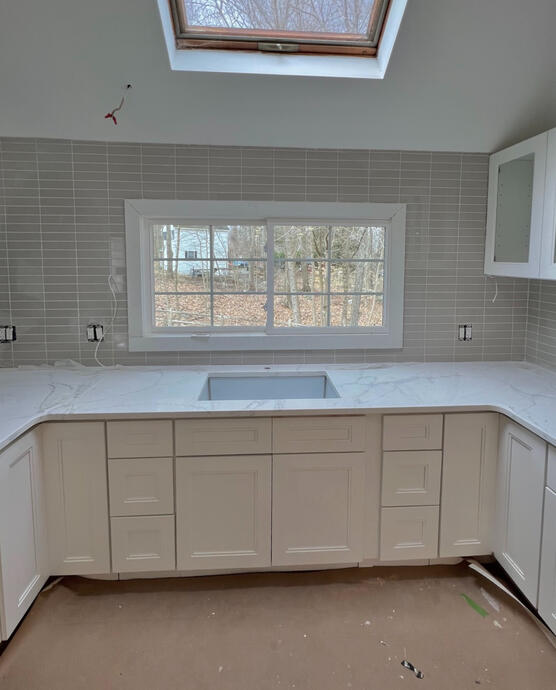 New window installation plus counter and cabinets