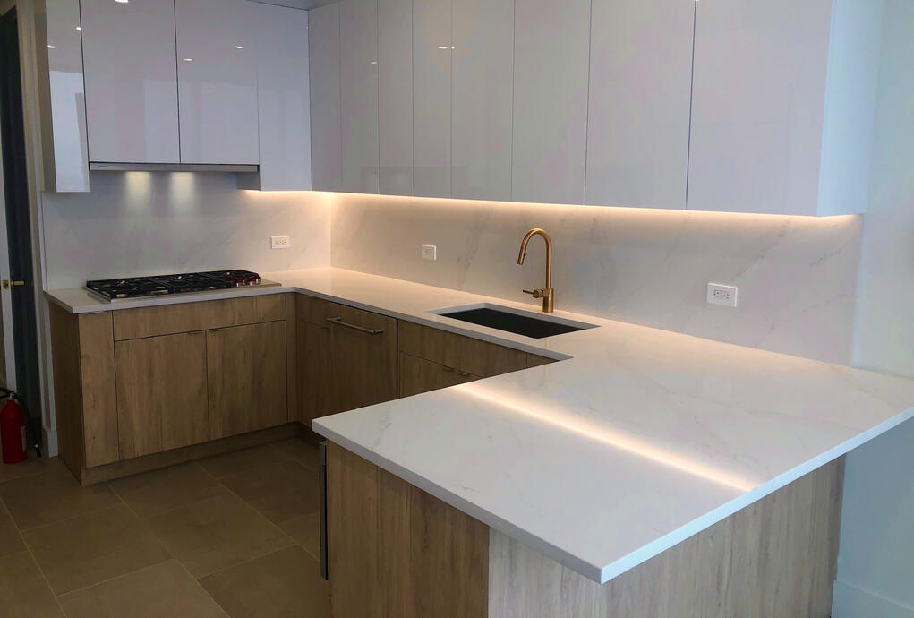 High-end kitchen design complete with under cabinet lighting and modern fixtures