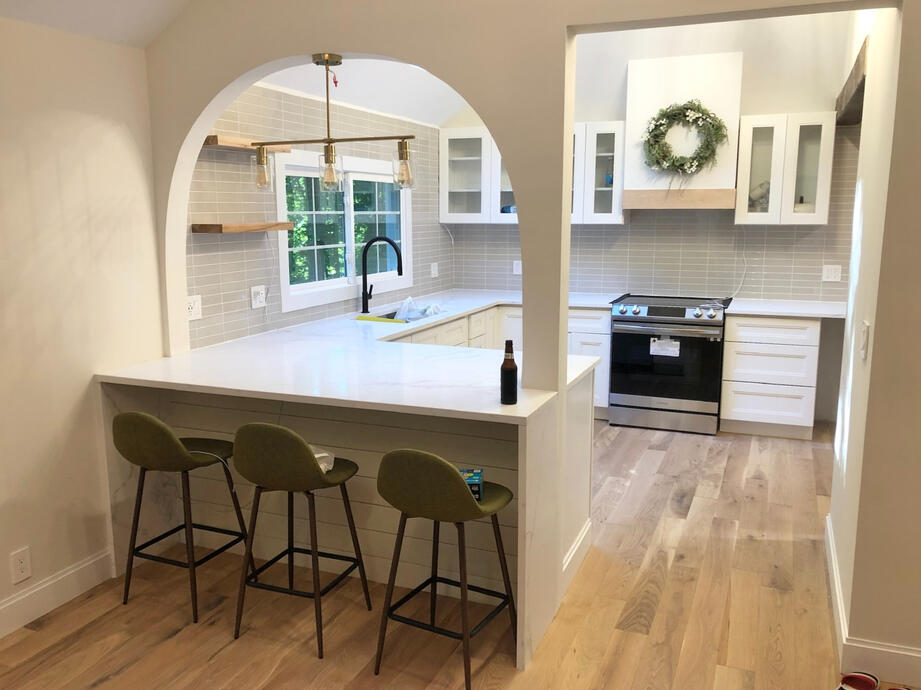 All new kitchen fixtures including island with arched opening